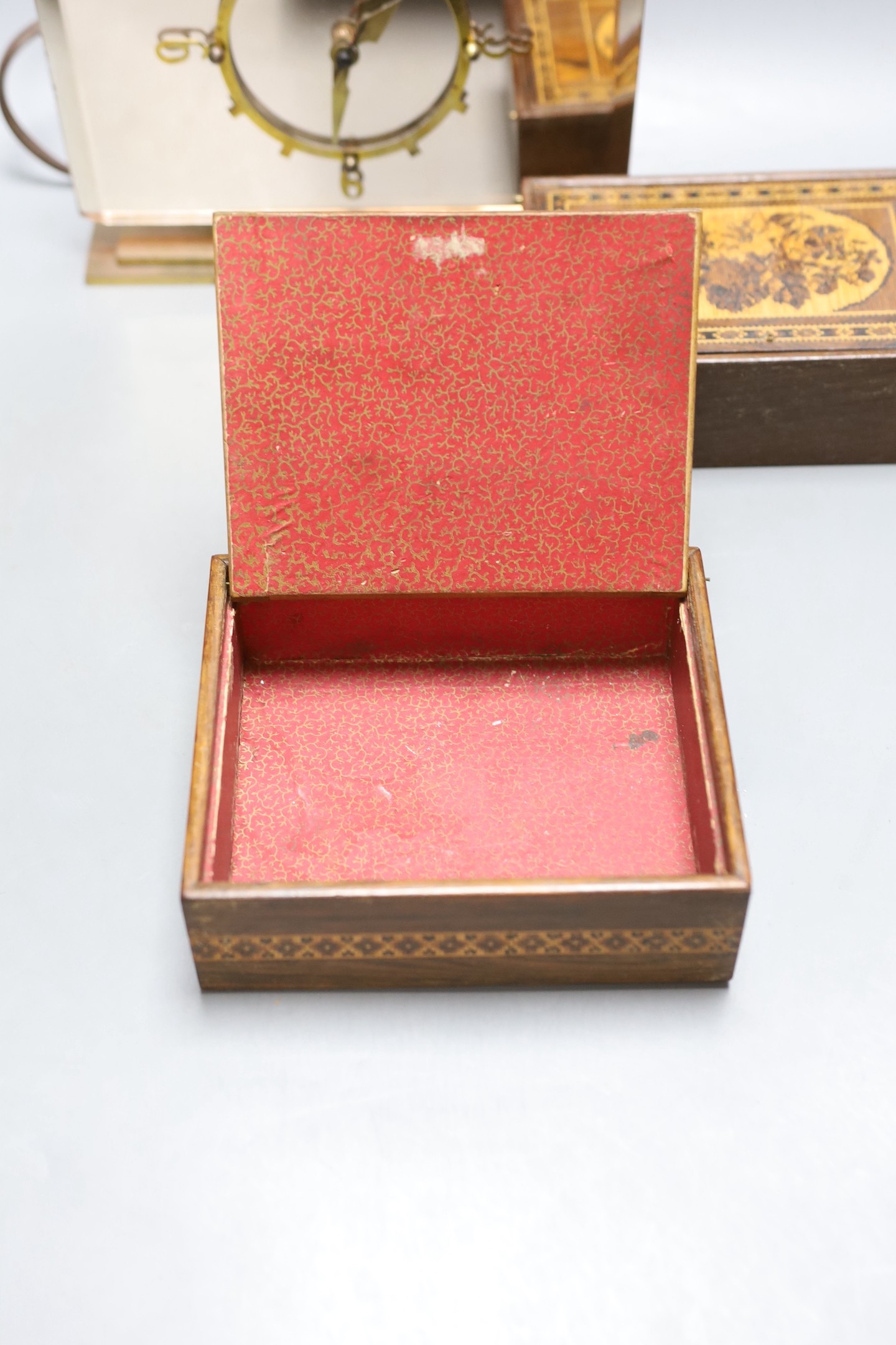 An Art Deco pink tinted glass electric mantel clock, 22cm, together with two 19th century Tunbridge ware floral tesserae mosaic pin hinge boxes, 15.3cm and 17cm (3)